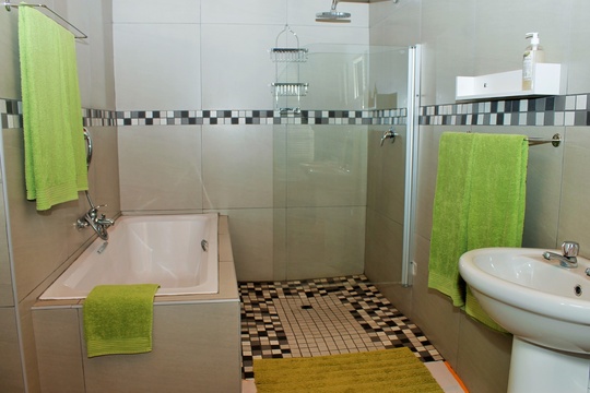 Full bathroom with bath and shower